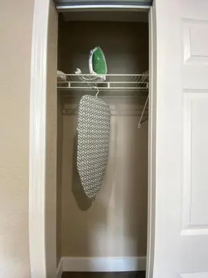 a closet with a tie on a shelf at Bella Breeze in Sanford