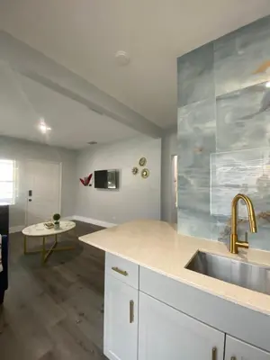 a kitchen with a sink and a counter top at Bella Breeze in Sanford