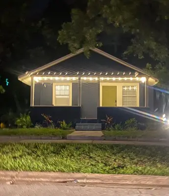 a house with lights on the front of it at night at Bella Breeze in Sanford