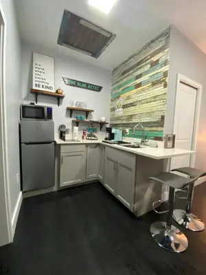 a large kitchen with a sink and a stove at The Blue Aztec in Sanford