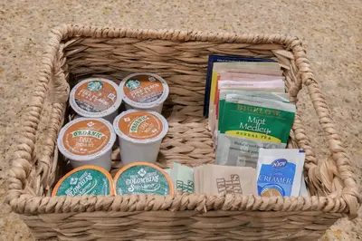 a basket filled with different types of items at Designer 3BR/2BA Corner Suite - Disney & Universal in Orlando