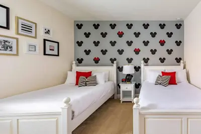 two white beds in a bedroom with red accents at Luxurious Encore Villa 10 Min Disney Inc/Waterpark in Orlando