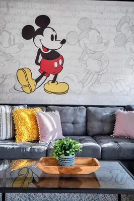 a living room with a mickey mouse wall mural at Newly Renovated Stylish Villa with Star Wars Mickey and Safari Themed Rooms #3TV4706 in Kissimmee