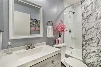 a bathroom with a sink and a toilet and a shower at Chic Orlando Family Getaway with Fenced Yard! in Orlando