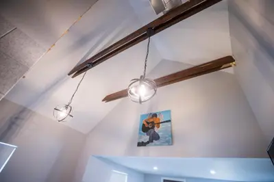 a room with three lights hanging from the ceiling at The Contemporary in Sanford