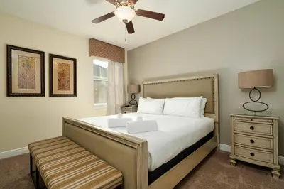 a bedroom with a bed and a ceiling fan at Encore Resort 11 Bedroom Home with Pool 2206 in Orlando