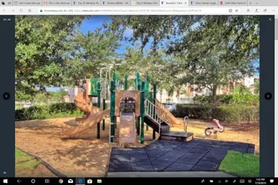 a playground with a slide in a park at Veteran Owned 3bdr/3 bath Townhouse w/WiFi 3mi to Disney - Fall/Winter Specials in Kissimmee