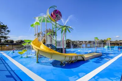 a water park with a slide in a pool at Windsor Dream - 6 bedroom resort pool home in Orlando