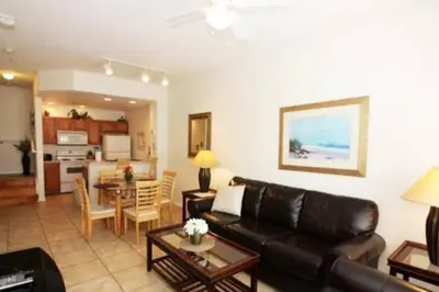a living room with a couch and a dining room at Family Friendly 3BR near Disney in Kissimmee