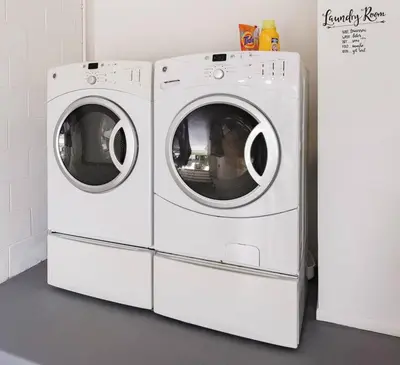 two white washing machines sitting next to each other at Orlando Boho Villa in Kissimmee