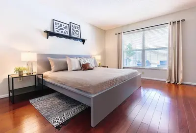 a bedroom with a large bed and a window at Orlando Boho Villa in Kissimmee