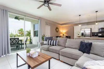 a living room with a couch and a table at Resort Near Disney FREE Waterpark 4741 in Kissimmee