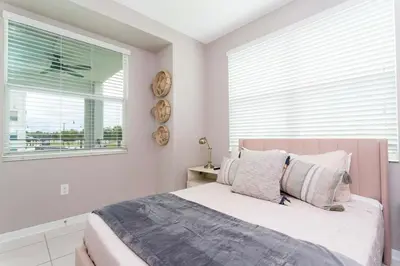 a bedroom with a large bed and a window at Resort Near Disney FREE Waterpark 4741 in Kissimmee