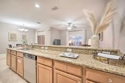 a kitchen with a sink and a counter top at Private Pool and Lanai Resort Townhome in Kissimmee in Kissimmee