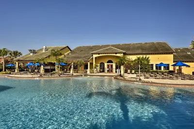 a swimming pool in front of a resort at Private Pool and Lanai Resort Townhome in Kissimmee in Kissimmee