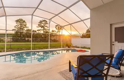 a swimming pool with a glass roof over a house at East Orlando Getaway - 3BR/2BTH - *Pool *Parking in Orlando