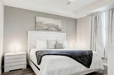 a bedroom with a white bed and a window at 4721 Unit 105 BRAND NEW stunning apartment in Kissimmee