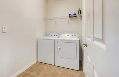 a white washer and dryer in a room at 6BR Resort Villa Near Disney Private Pool 2584 in Kissimmee