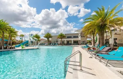 a swimming pool at a resort with palm trees at 6BR Resort Villa Near Disney Private Pool 2584 in Kissimmee