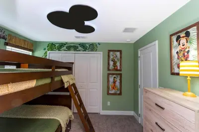 a bedroom with a bunk bed with a black cloud on the ceiling at Mickey Safari near Disney 2 Master rooms 4708 in Kissimmee