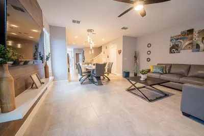 a living room with a couch and a table at Relax water view with Hammock near Disney 4736 in Kissimmee