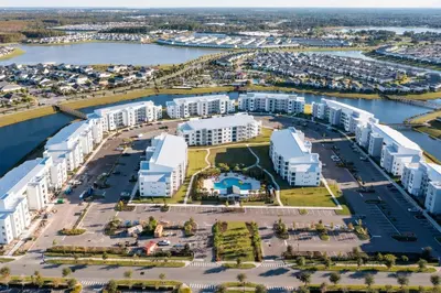 an aerial view of a large apartment complex with a marina at Modern Resort FREE Waterpark Near Disney 3171 in Kissimmee