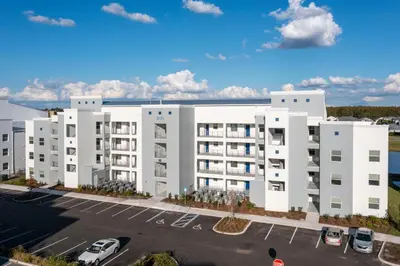 an aerial view of a white apartment building at Modern Resort FREE Waterpark Near Disney 3171 in Kissimmee