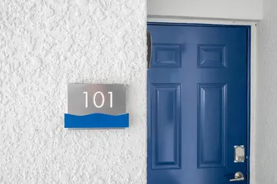 a blue door and a sign on a wall at Modern Resort FREE Waterpark Near Disney 3171 in Kissimmee