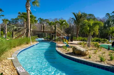 a pool at a resort with a slide at Resort Condo Near Disney FREE Waterpark 3120 in Kissimmee