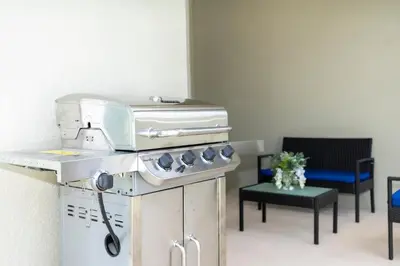a kitchen with a stove and a microwave on a counter at Special offer near Disney - free waterpark 2857 in Kissimmee