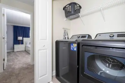 a washer and dryer in a room with a bathroom at Special offer near Disney - free waterpark 2857 in Kissimmee