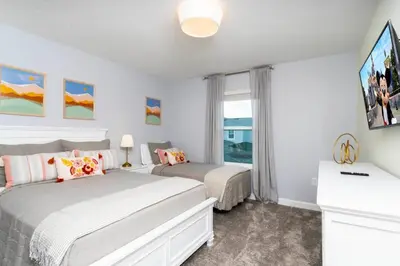 a bedroom with two beds and a large window at Special offer near Disney - free waterpark 2857 in Kissimmee