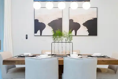 a dining room with a wooden table with chairs at free resort access, private pool near disney 2966 in Kissimmee