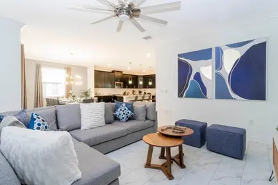 a living room with a couch and a table at Resort-Style Private Pool & Spa Modern 2920 in Kissimmee