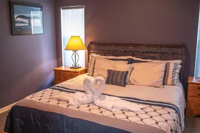 two swans made out of towels on a bed at Luxury Disney Family Villa (5-Bedroom, pool & spa) in Kissimmee