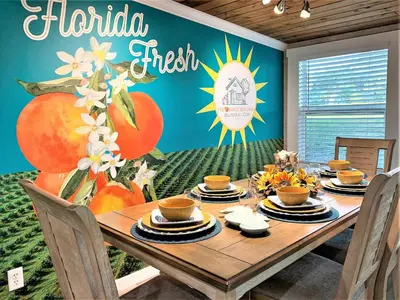 a dining room with a table with a sign that reads hortolia fresh at FUN! PoolLake near Disney Fast WiFi Pickleball in Clermont