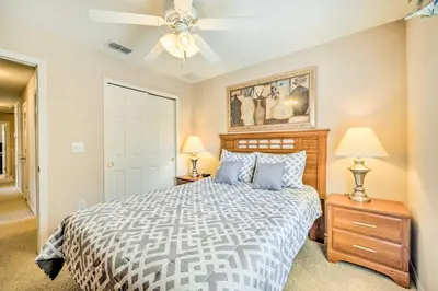 a bedroom with a bed and a ceiling fan at Kissimmee Getaway about 4 Mi to Walt Disney World in Kissimmee