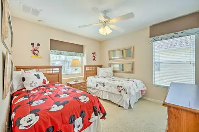 a bedroom with two beds and a ceiling fan at Kissimmee Getaway about 4 Mi to Walt Disney World in Kissimmee