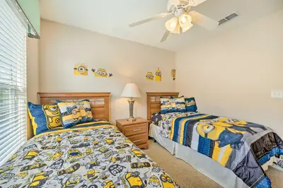 a bedroom with two beds and a ceiling fan at Kissimmee Getaway about 4 Mi to Walt Disney World in Kissimmee