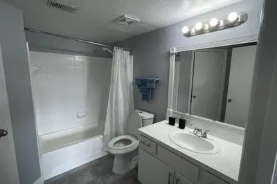 a bathroom with a sink and a toilet and a shower at very Nice 2/2 apartment , close to disney in Kissimmee