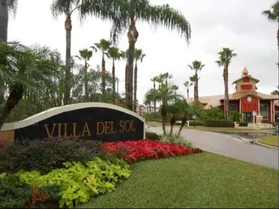 a sign for the villa del sol with palm trees at very Nice 2/2 apartment , close to disney in Kissimmee
