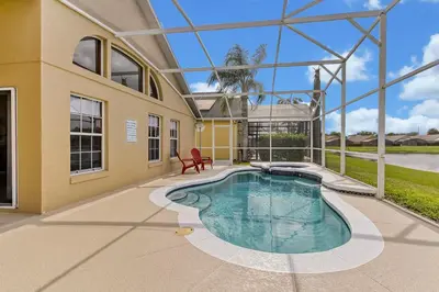 a swimming pool in the middle of a house at Star Lake Oasis - 4 bed family pool home in Orlando