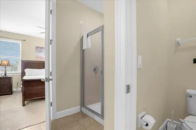 a bathroom with a shower and a toilet at GREAT HOUSE Near Disney, Private Pool in Orlando