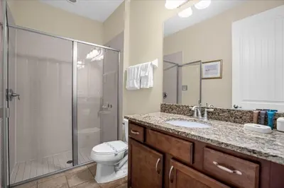 a bathroom with a toilet and a shower and a sink at GREAT HOUSE Near Disney, Private Pool in Orlando