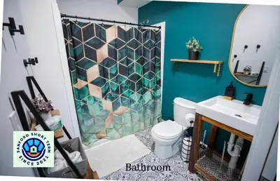 a bathroom with a toilet and a shower at Boho Nights in Sanford