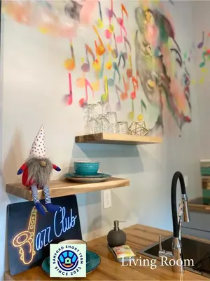 a kitchen counter with a restaurant sign with a gnome on it at The Jazz Loft in Sanford