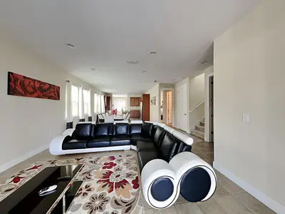 a living room with a black and white couch at 561 - 8BD Villa - Private PoolSpa by Disney in Orlando
