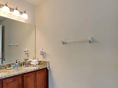 a bathroom with two sinks and a large mirror at 561 - 8BD Villa - Private PoolSpa by Disney in Orlando