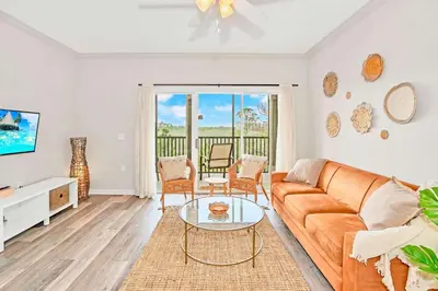 a living room with a couch and a table at Stylish 3BR Suite with Swimming Pool - Near Disney in Orlando