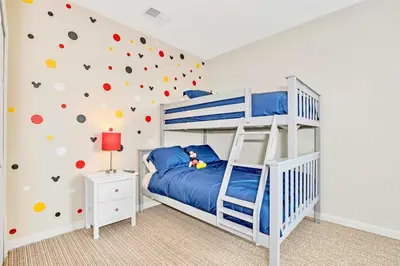 a bedroom with a bunk bed with a climbing wall at Stylish 3BR Suite with Swimming Pool - Near Disney in Orlando
